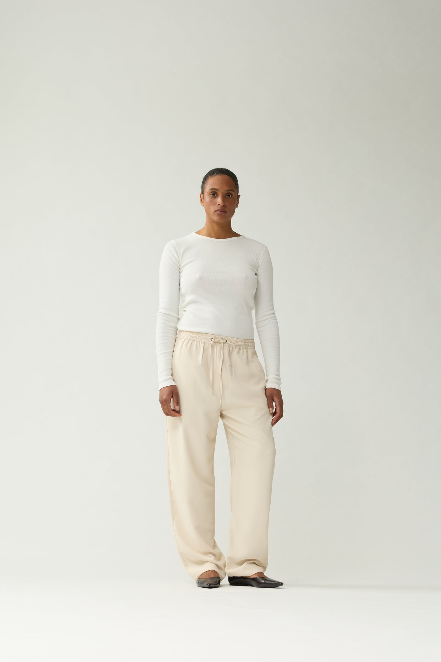 New Amsterdam Surf Association Sand Work Trousers - Model Front View Unisex Wide Leg Sand Trousers Streetwear
