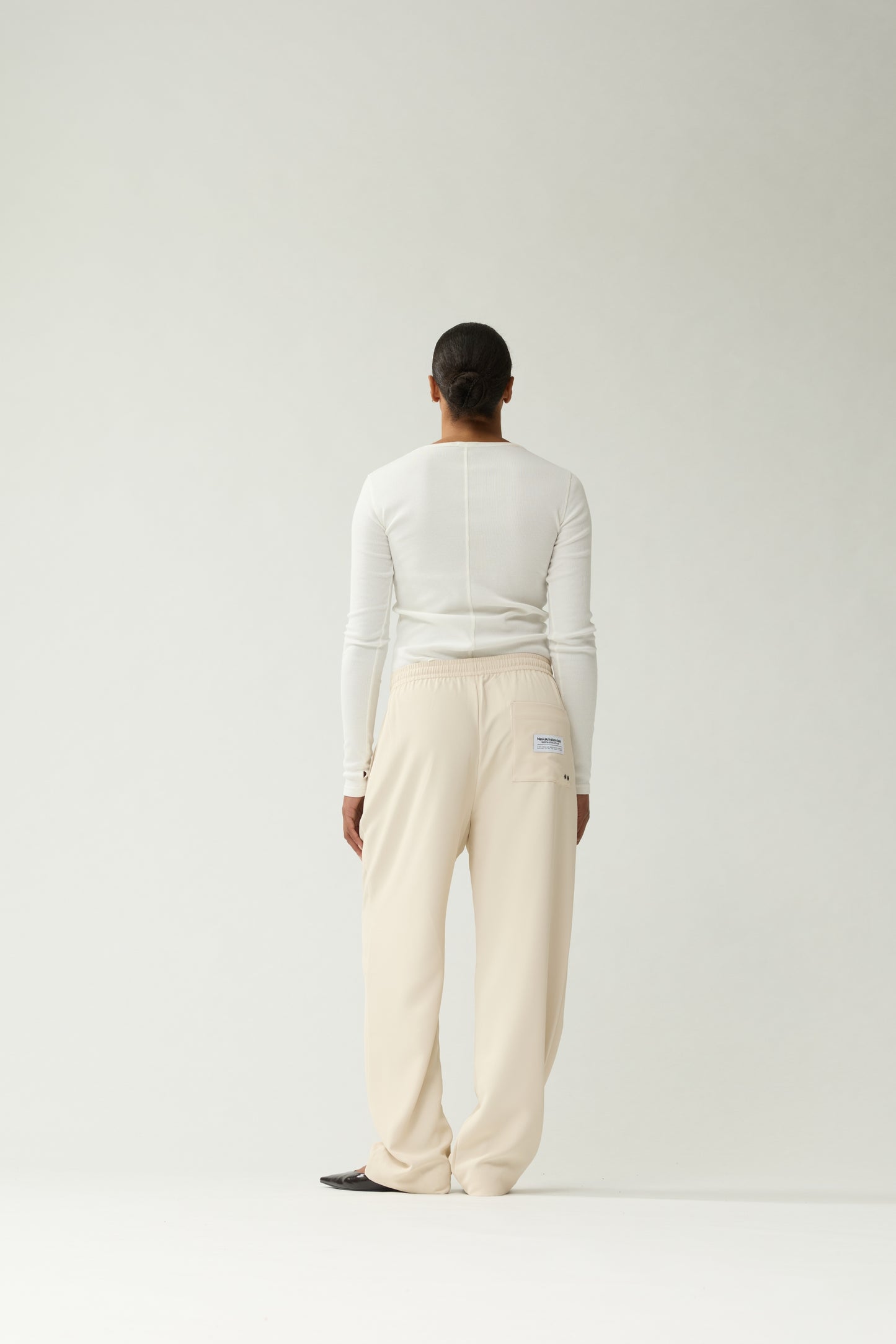 New Amsterdam Surf Association Sand Work Trousers - Model Back View Logo Patch Detail Elastic Waistband Wide Leg
