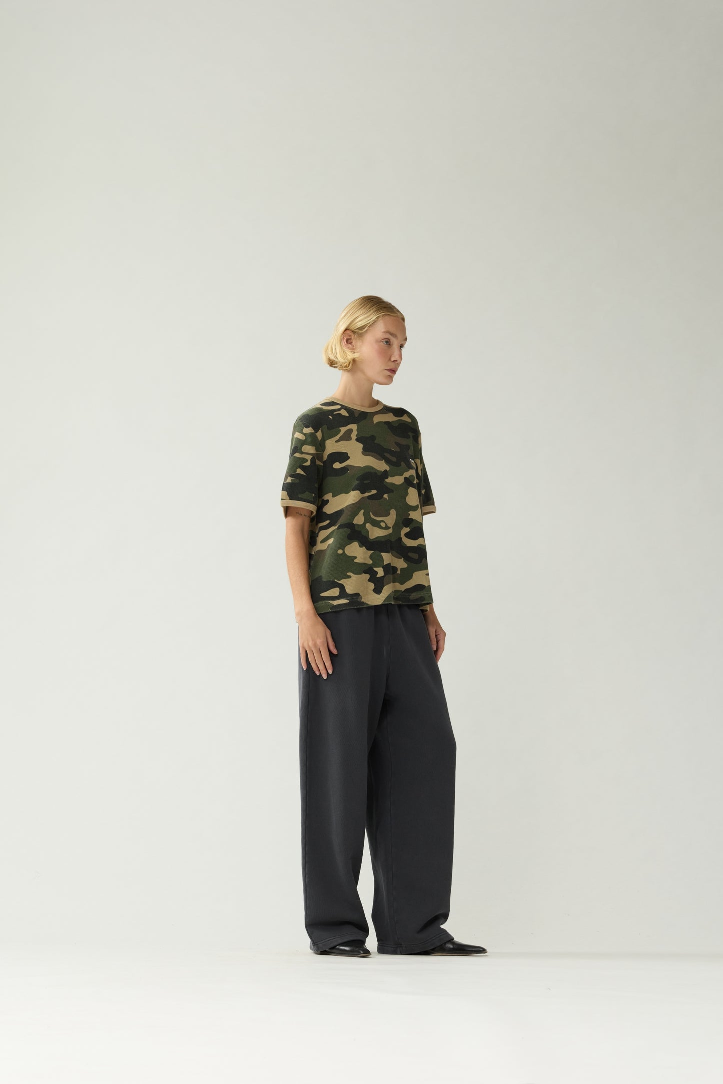New Amsterdam Surf Association Camo Waffle Tee - Model Three-Quarter Front View Mesh Camo Pattern Short Sleeve