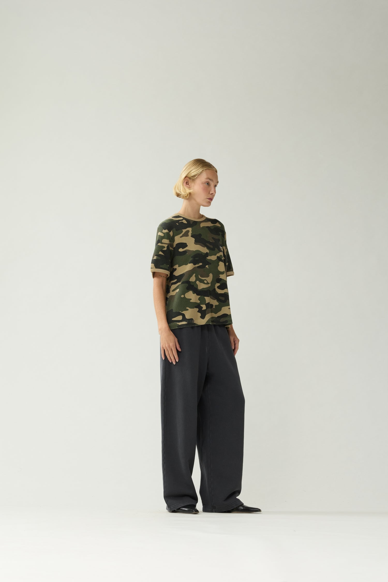 New Amsterdam Surf Association Camo Waffle Tee - Model Three-Quarter Front View Mesh Camo Pattern Short Sleeve