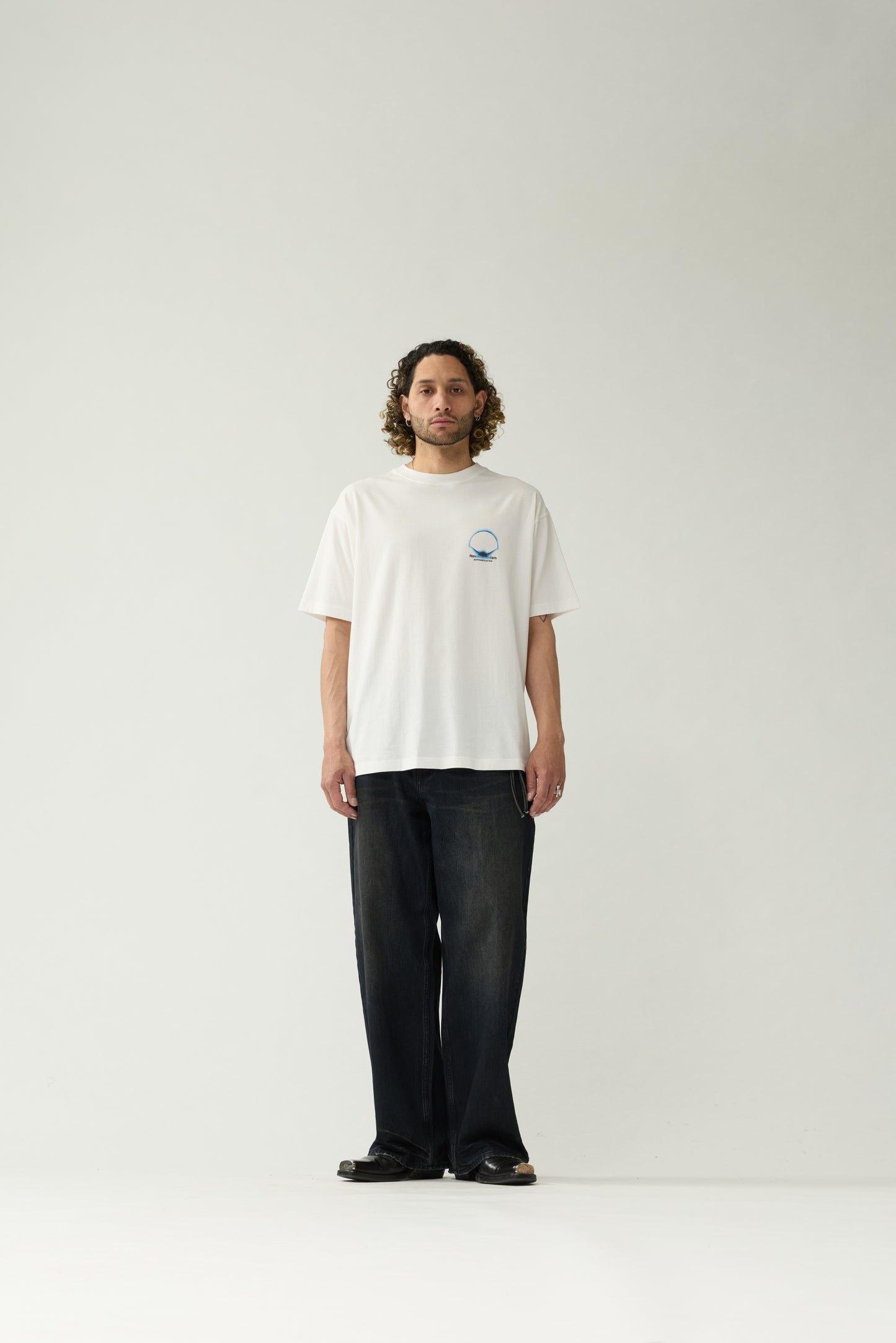New Amsterdam Surf Association White Eclipse Tee - Model Front View Full Body Chest Graphic Oversized Fit