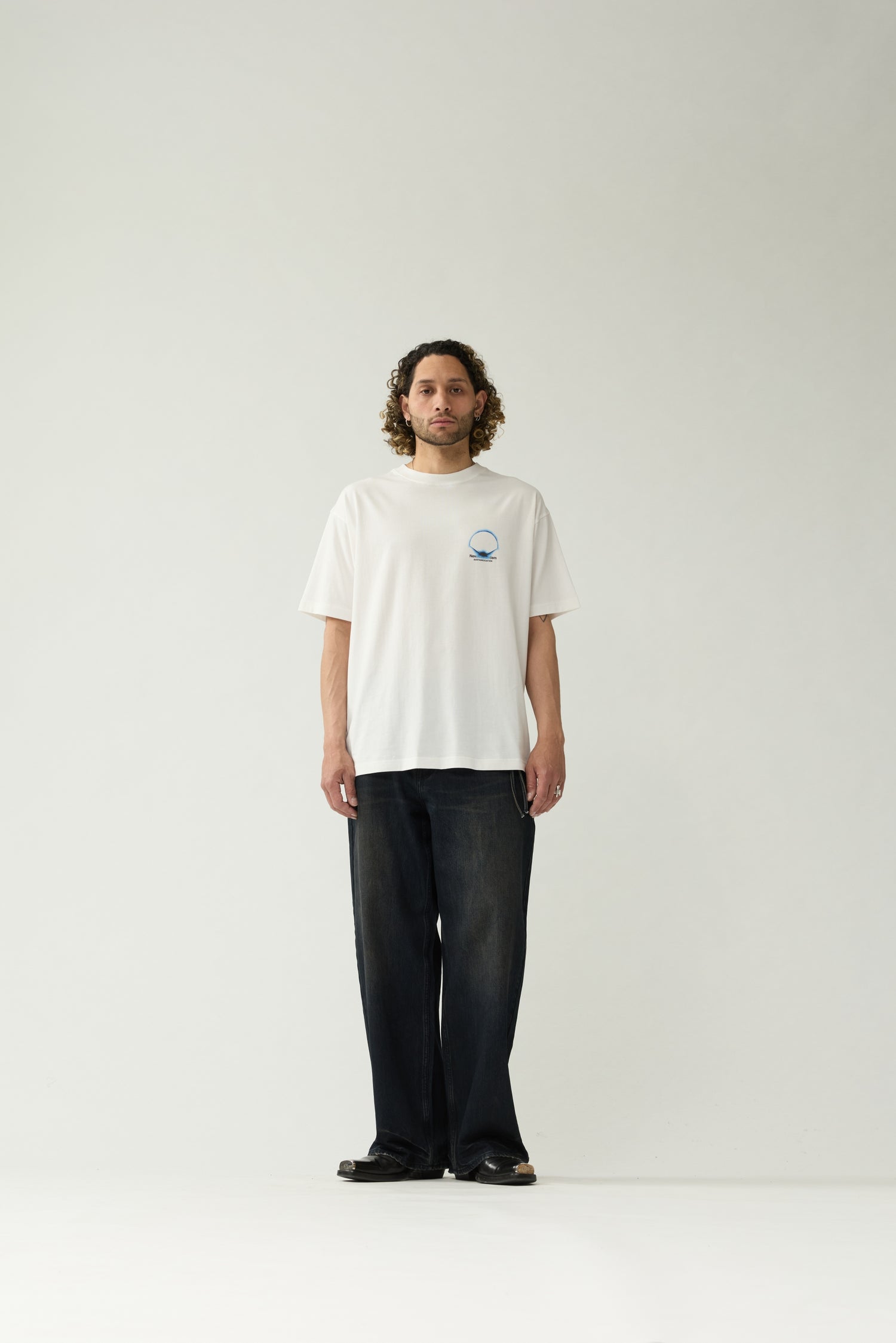 New Amsterdam Surf Association White Eclipse Tee - Model Front View Full Body Chest Graphic Oversized Fit