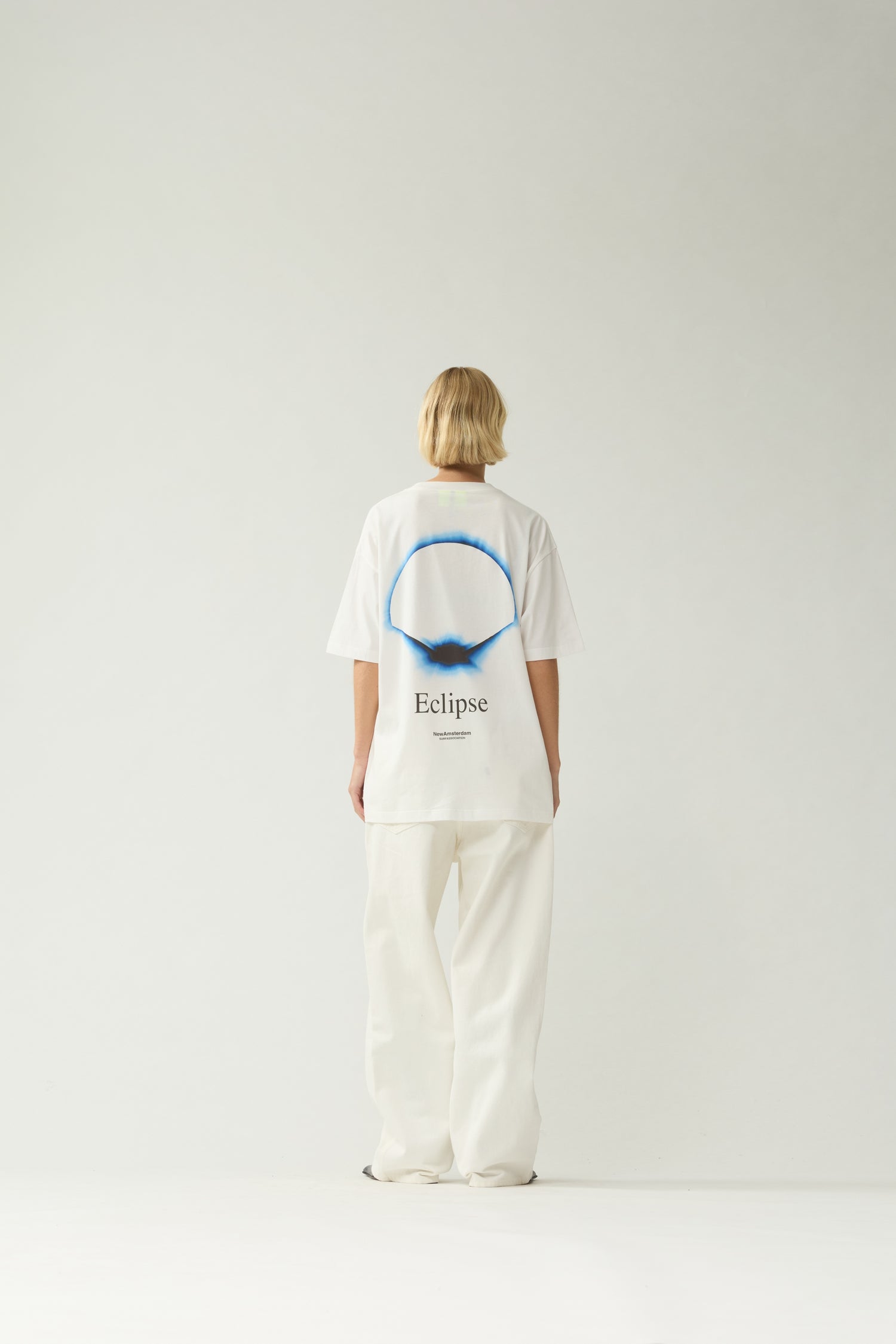 New Amsterdam Surf Association White Eclipse Tee - Model Back View Eclipse Ring Back Print Short Sleeve Tee