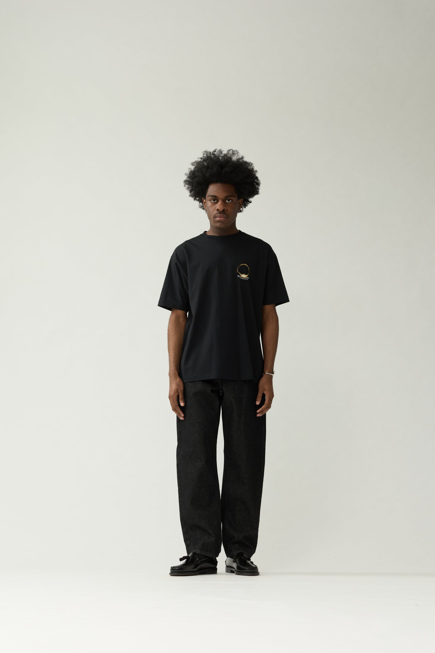 New Amsterdam Surf Association Black Eclipse Tee - Back Close-Up Glowing Eclipse Solar Ring Graphic Flat Lay