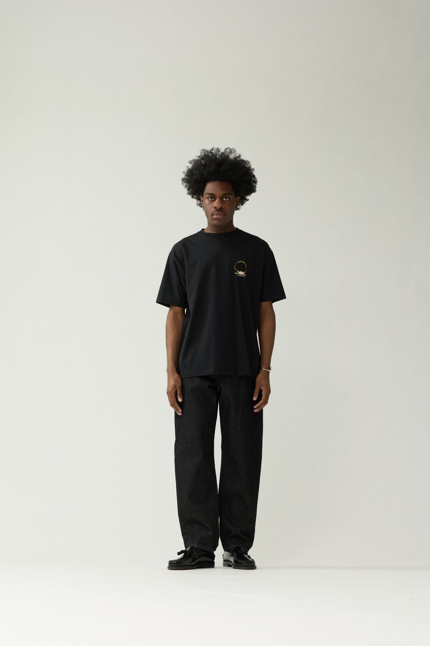 New Amsterdam Surf Association Black Eclipse Tee - Back Close-Up Glowing Eclipse Solar Ring Graphic Flat Lay