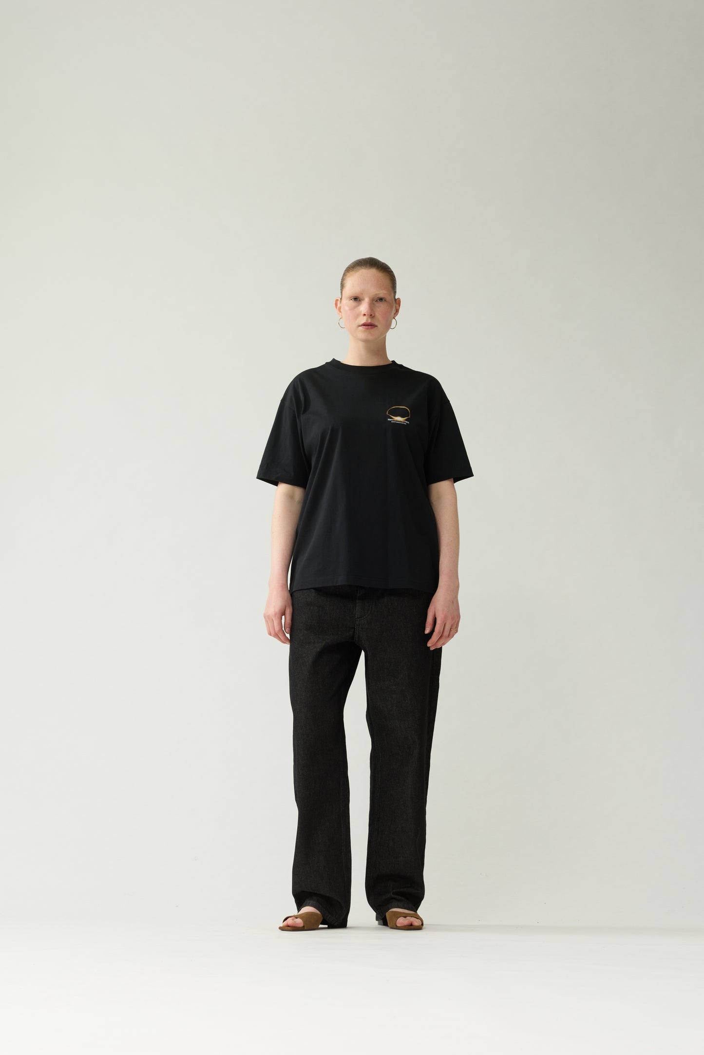 New Amsterdam Surf Association Black Eclipse Tee - Model Front View Unisex Relaxed Fit All-Black Streetwear Look