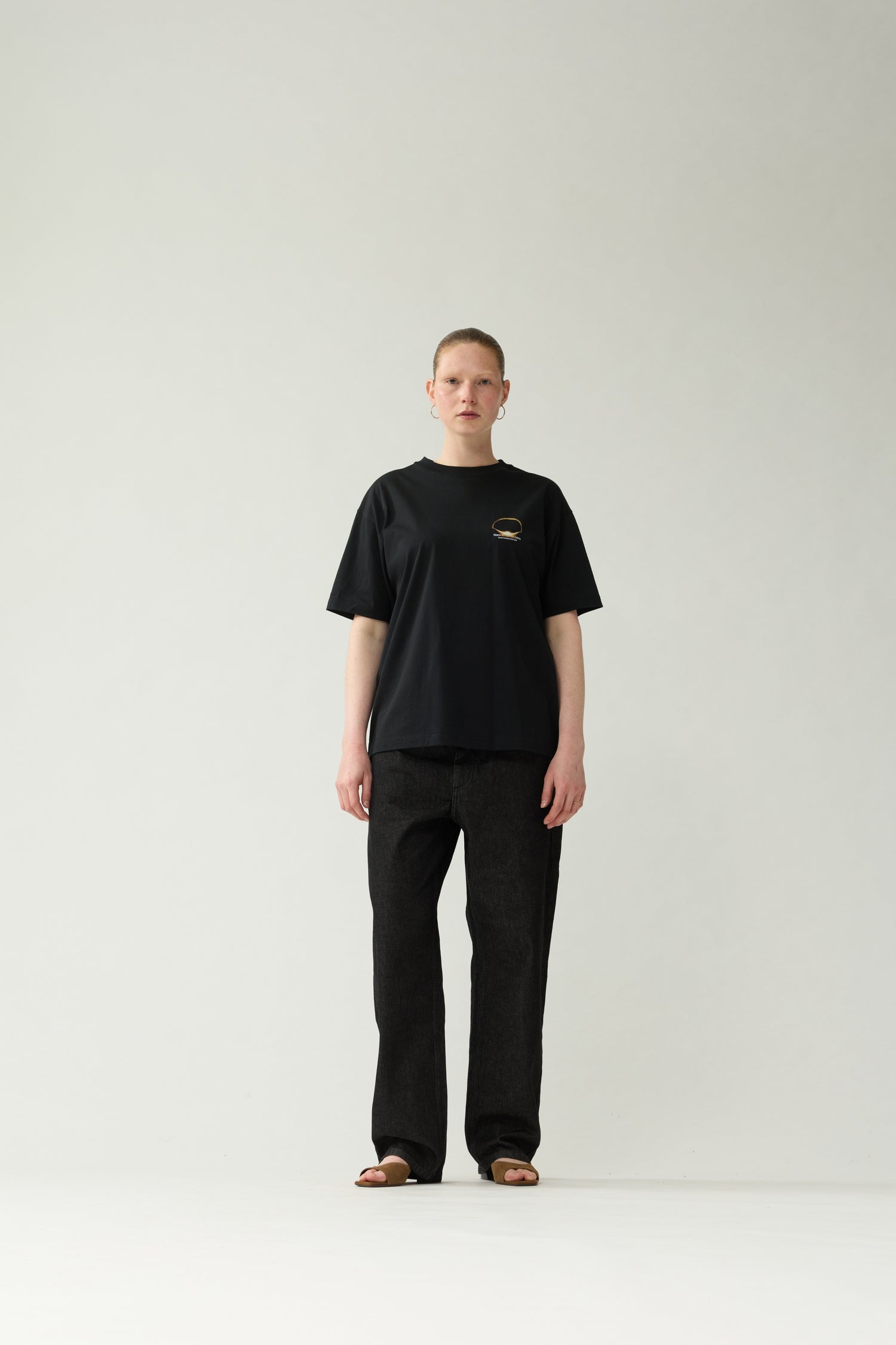 New Amsterdam Surf Association Black Eclipse Tee - Model Front View Unisex Relaxed Fit All-Black Streetwear Look